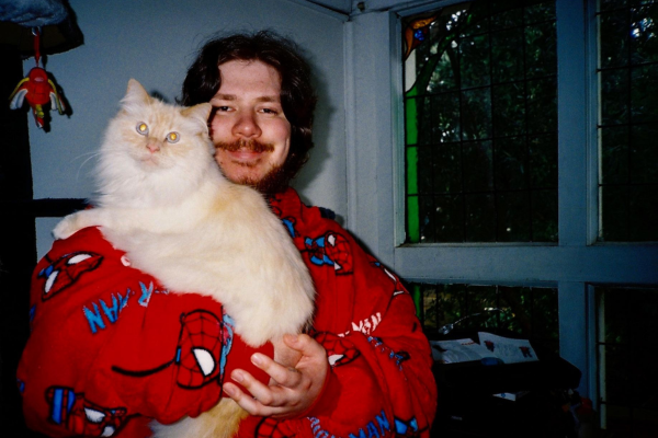 man holding a cat